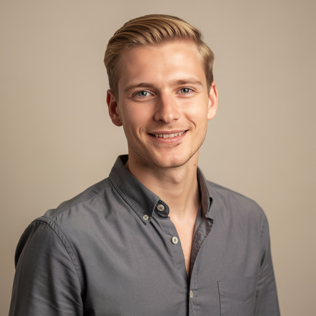Studio portrait of a young Belgian man with short blond hair