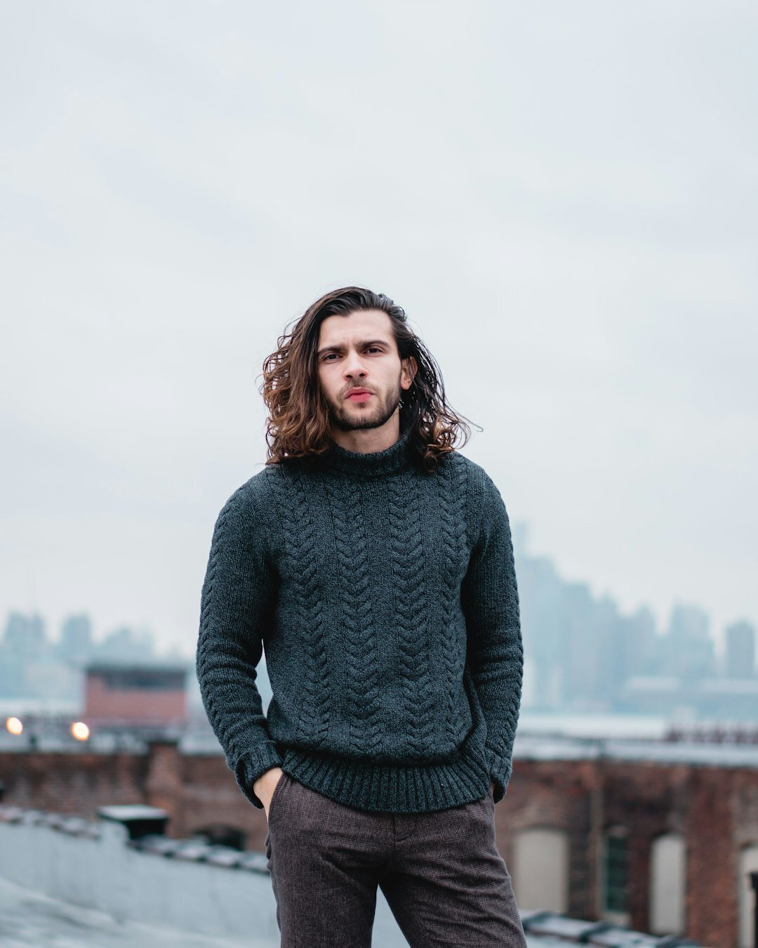 Portrait of a smiling Belgian man in a casual sweater